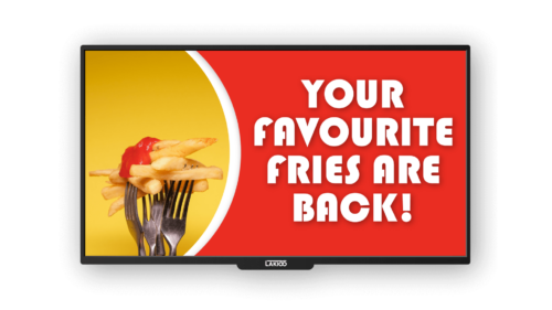 Crispy fries topped with ketchup on a fork against a vibrant yellow and red background, displayed on a LAKIOO digital kiosk screen with the message 'Your Favourite Fries Are Back!