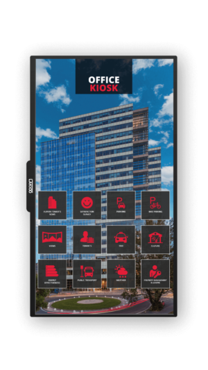 Digital office kiosk display located in front of a modern high-rise office building, featuring a grid of icons for various services such as appointments, parking, taxis, and more, against a clear blue sky.